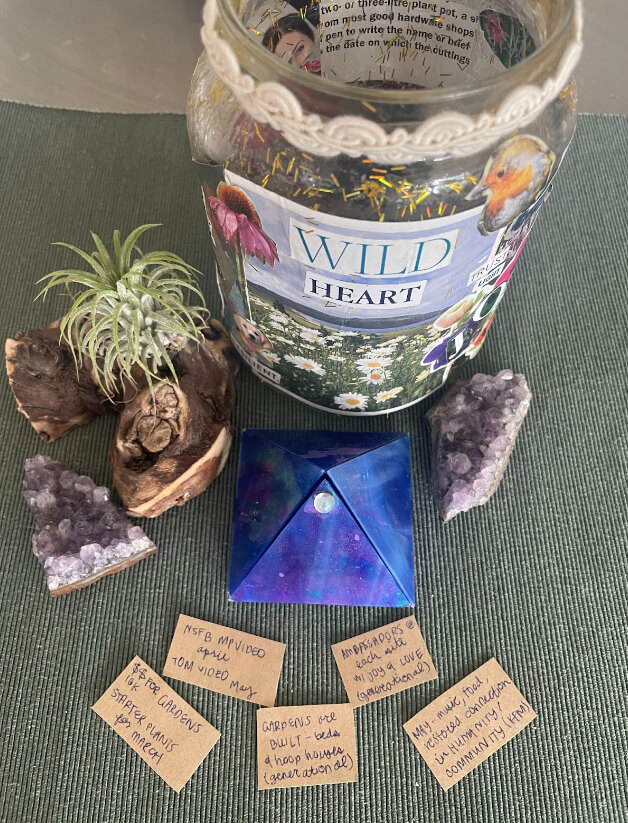 gratitude candle with intentions, geode rocks, crystals and air plant